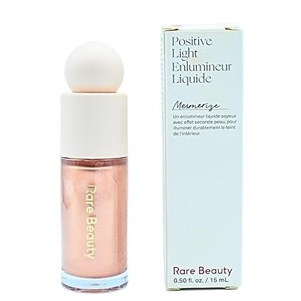 Rare Beauty Positive Light Liquid Luminizer Mesmerize liquid highlighter bottle showing radiant glowing skin finish at ApheliaZone
